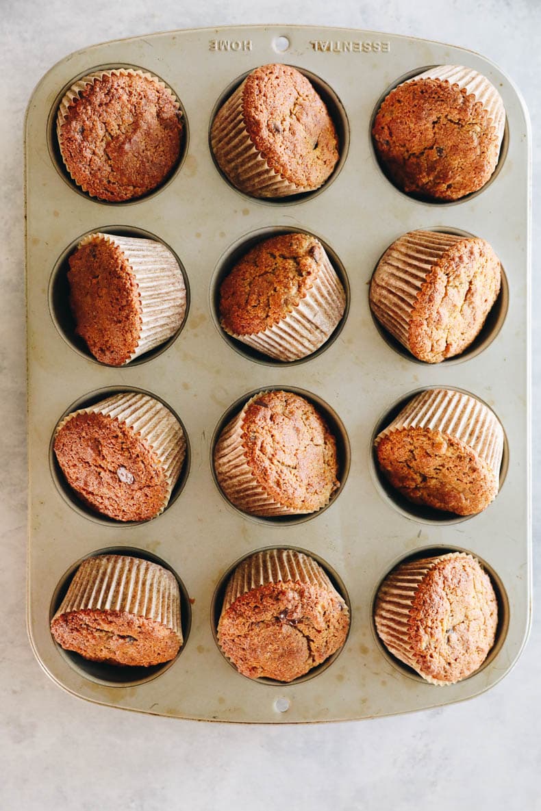 almond banana muffins in a muffin tin.