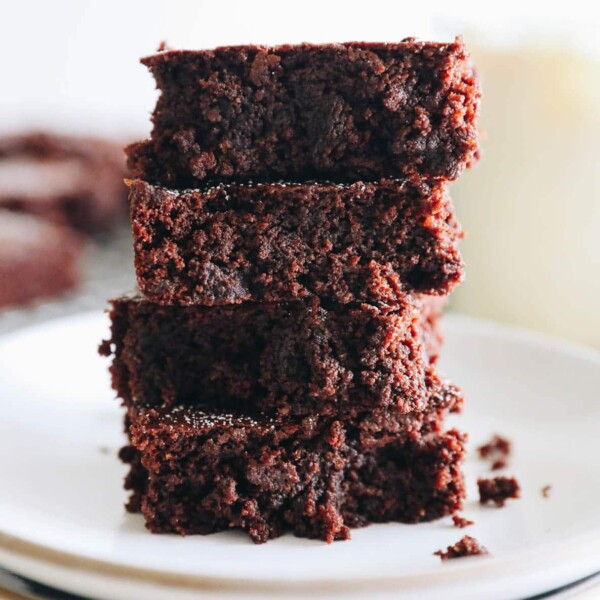 4 almond flour brownies stacked on top of each other.