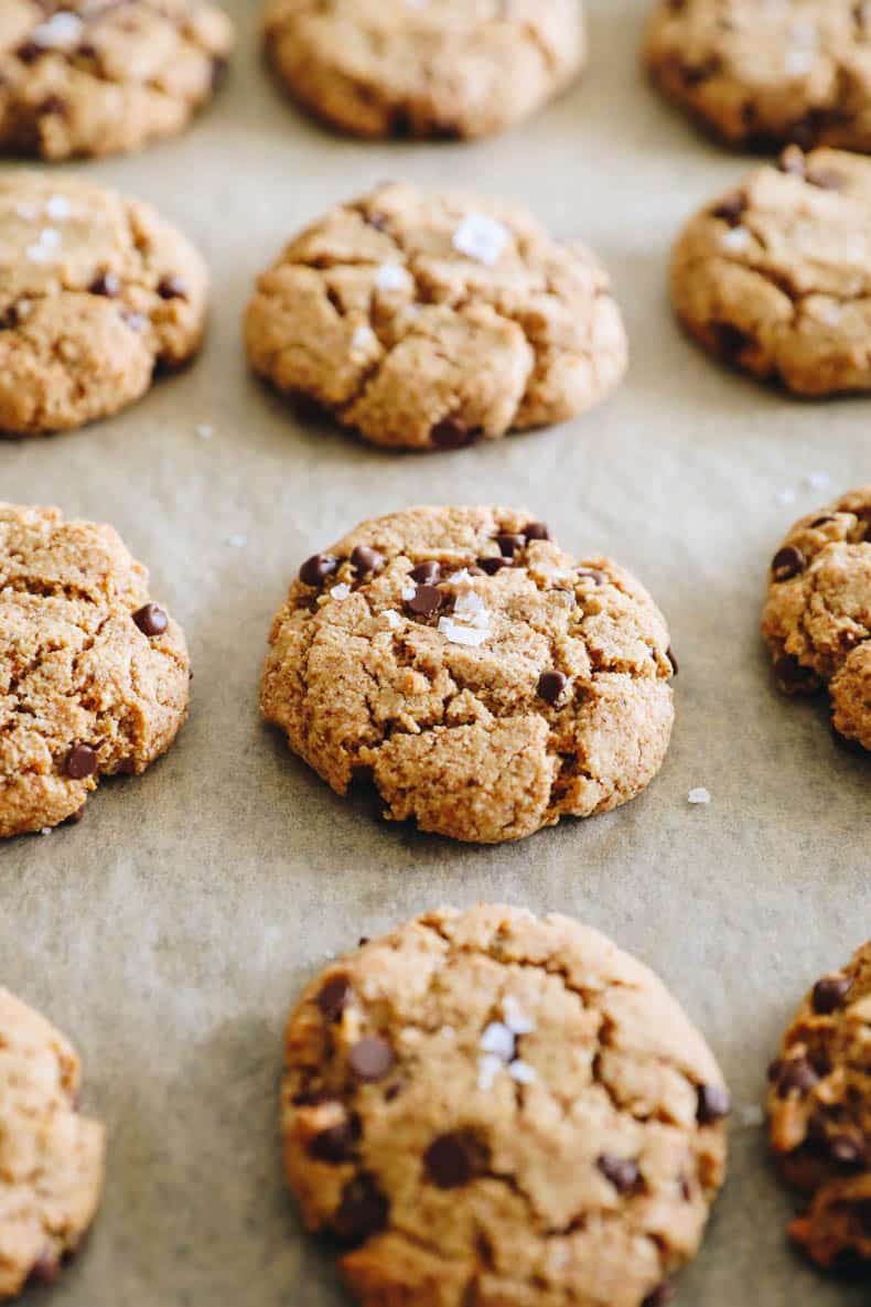 almond flour chocolate chip cookies on a baking sheet with parchment paper.