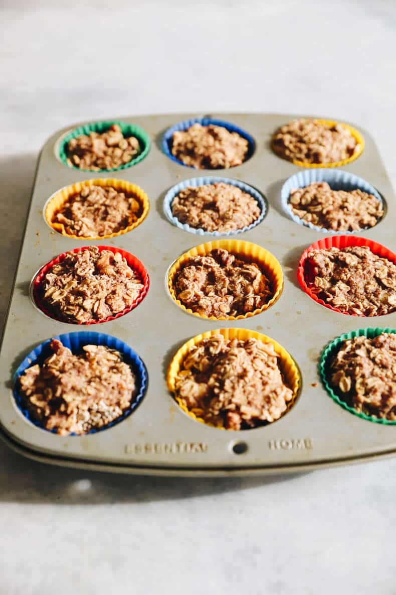 banana baked oatmeal muffins in a muffin tin.