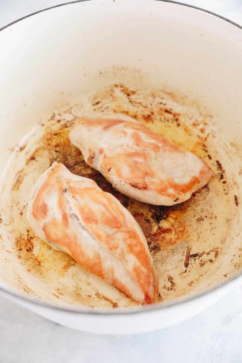 cooked chicken in a large dutch oven.