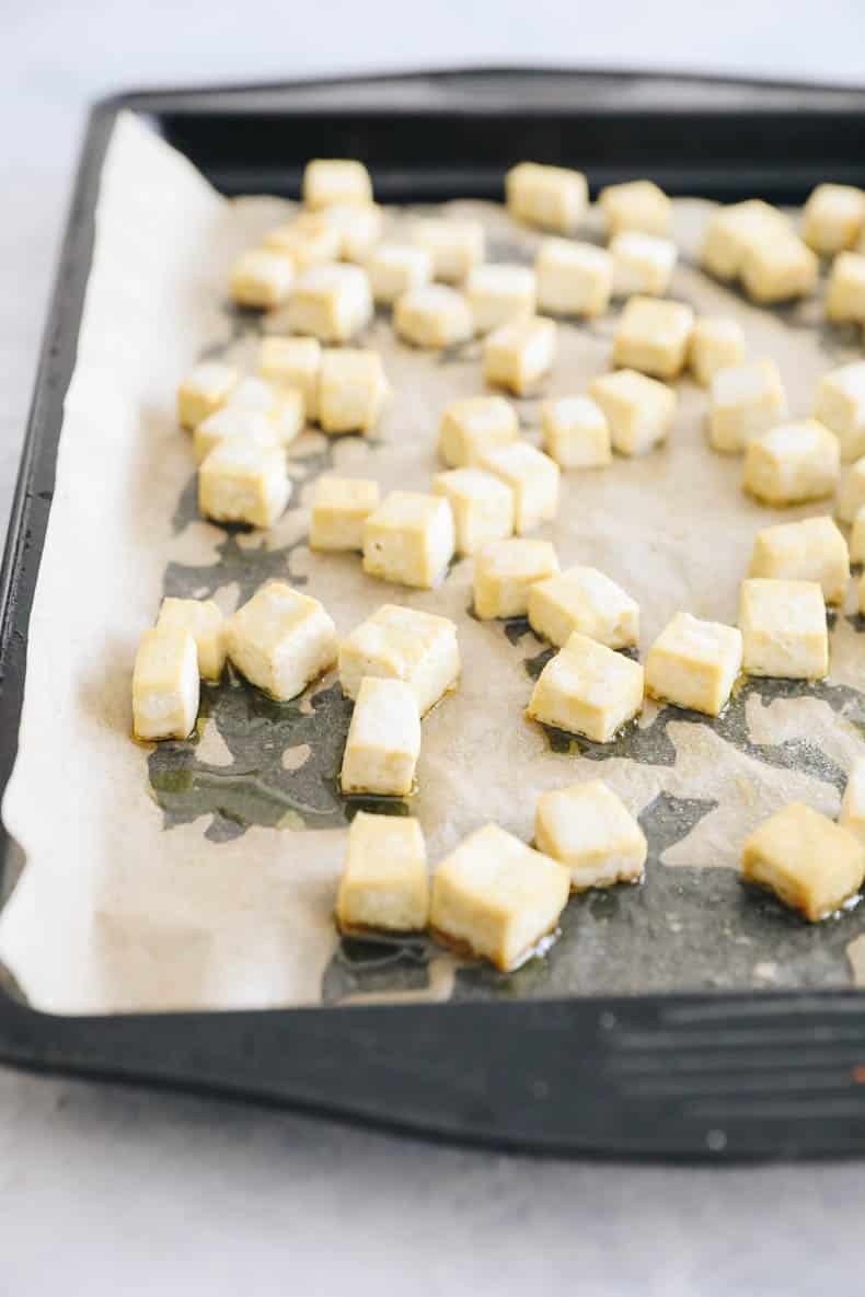 Baked tofu on a sheet pan.