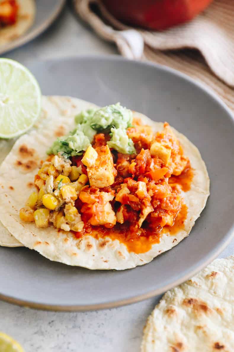 vegan chipotle sofritas on a taco with guacamole + corn.