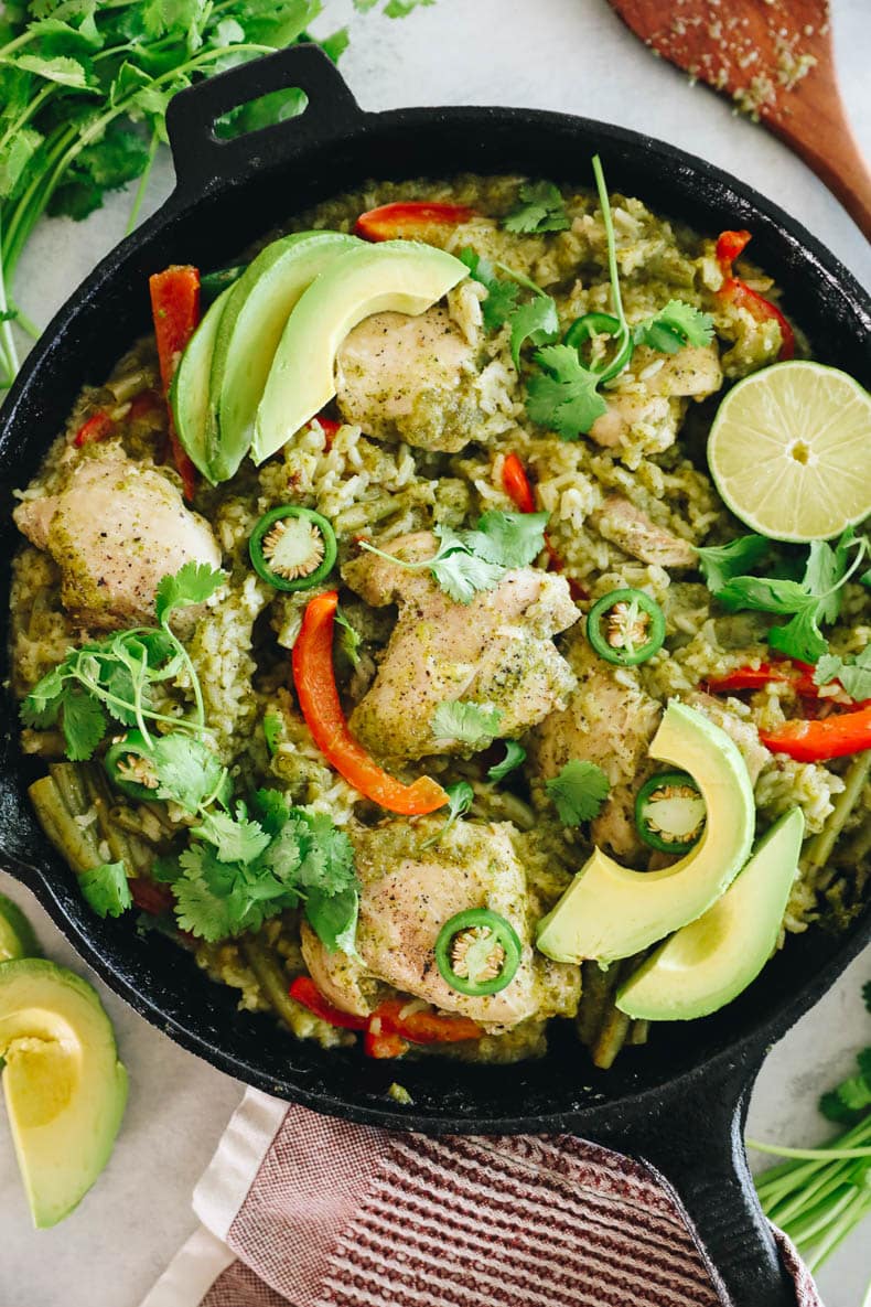 cilantro lime chicken thighs with rice and veggies in a cast iron pan