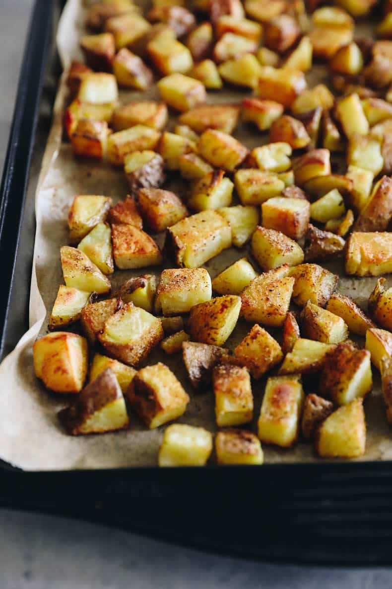 crispy roasted potatoes on a baking sheet.