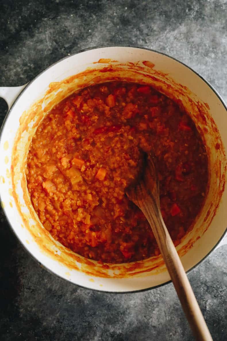 Cooked vegetable dal recipe in a white dutch oven