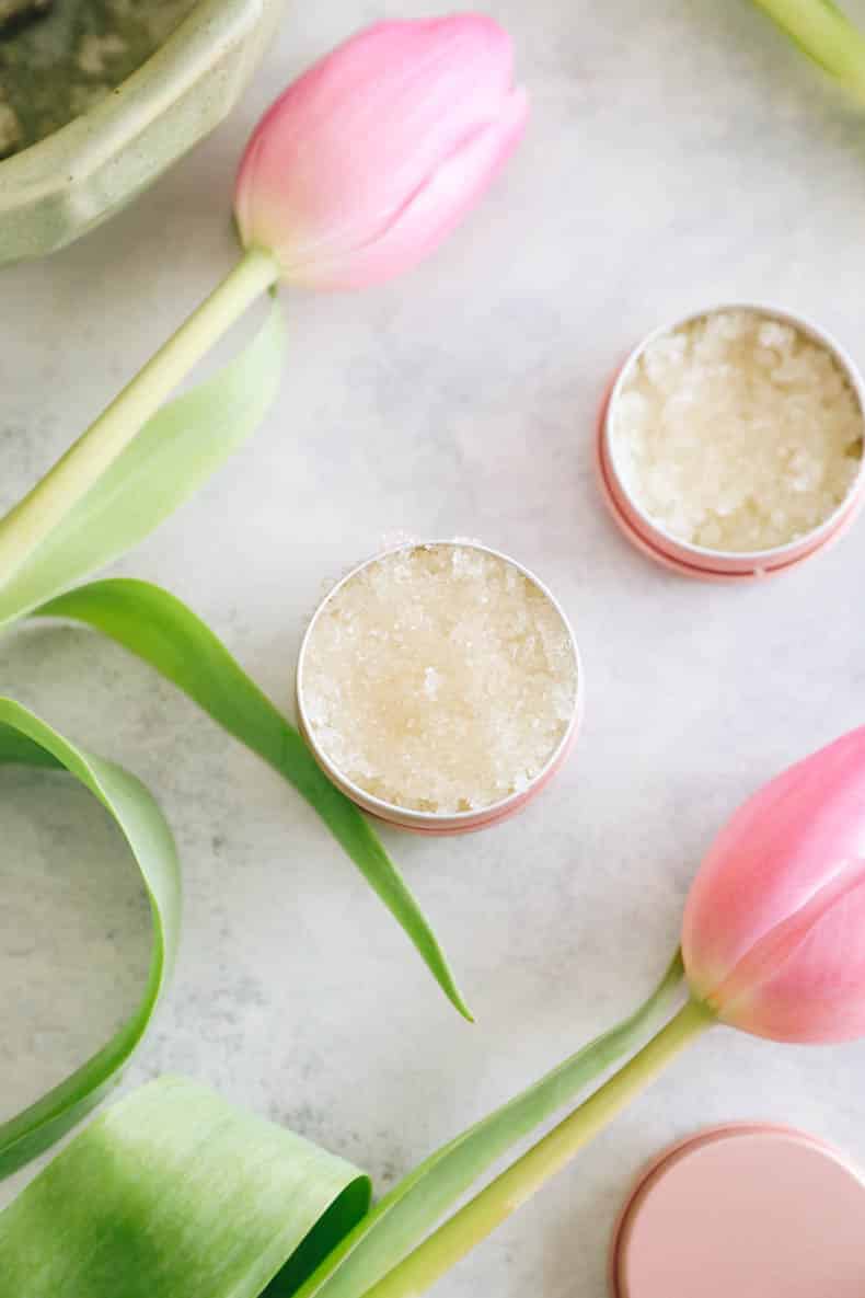 homemade lip scrub in small pink metal tins.