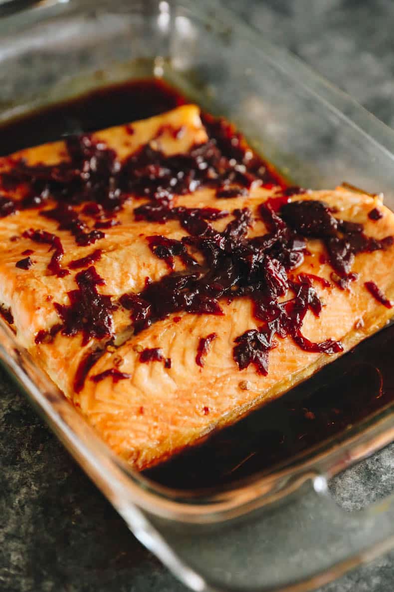 easy baked salmon in a baking dish topped with chipotle marinade