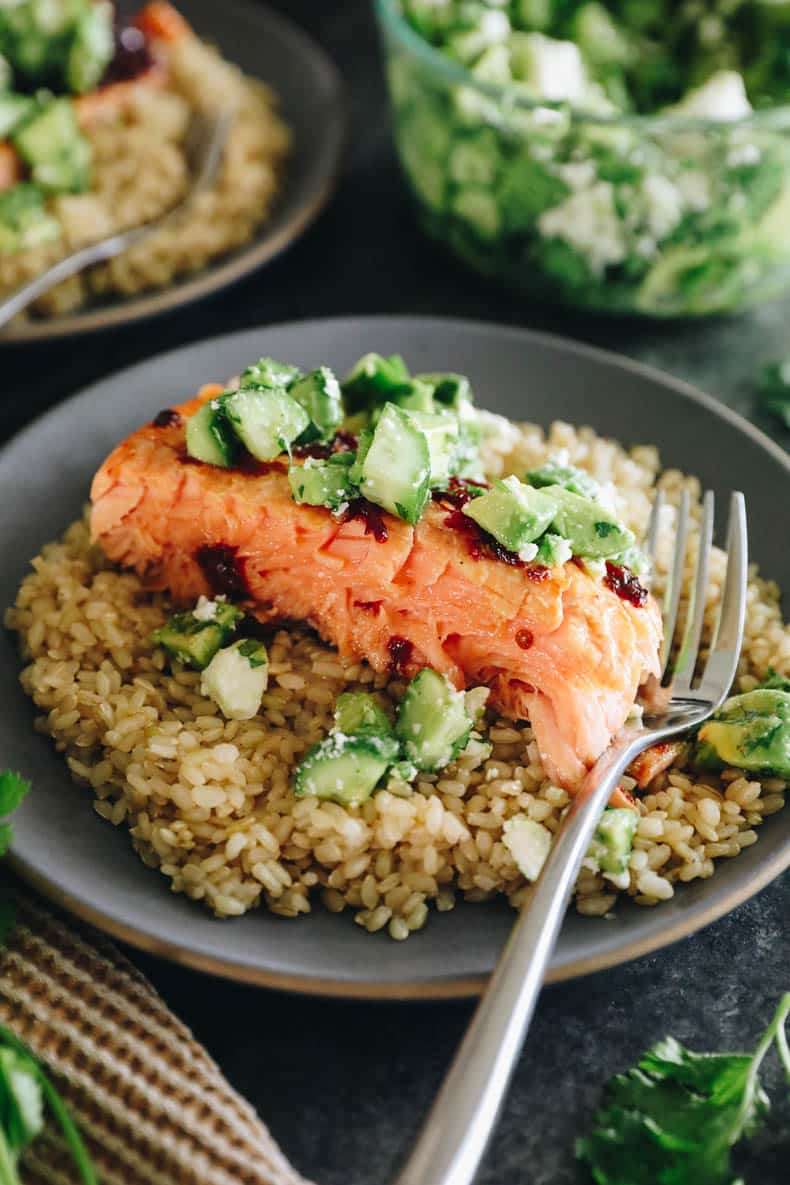 chipotle salmon with avocado salsa on a bed of brown rice.