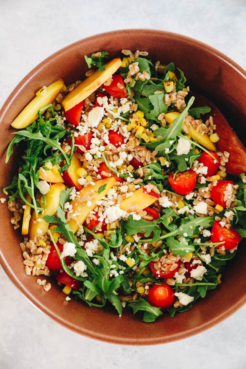 farro salad in a large brown bowl.