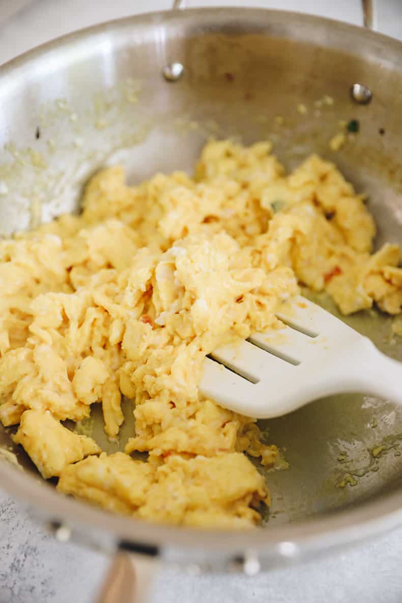 cooked eggs in a pan for freezer breakfast burritos