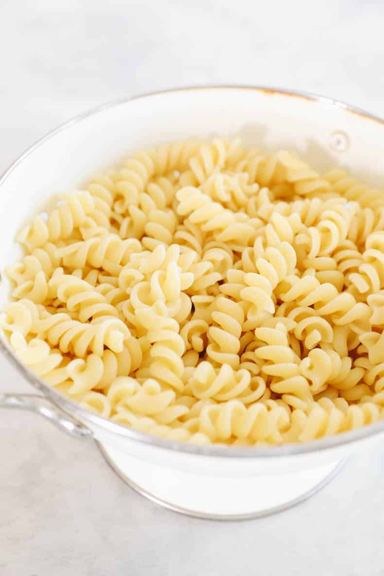 fusili noodles in a white colander