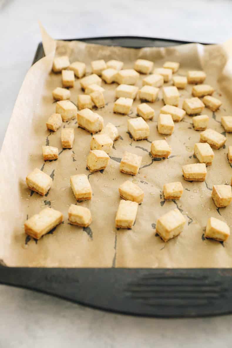 cubed and roasted tofu on a sheet pan.