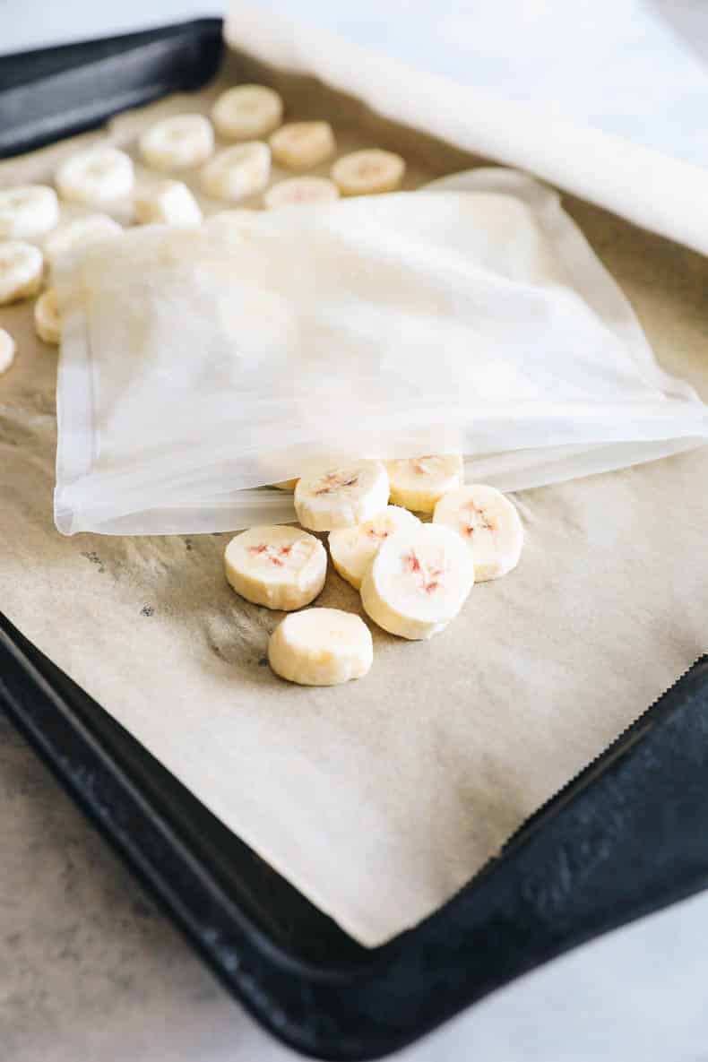 frozen banana coins on a baking sheet.