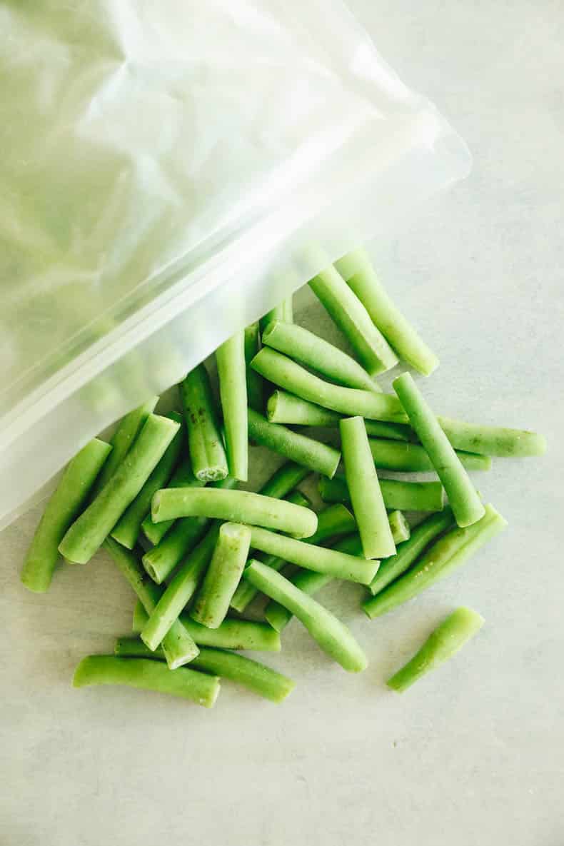 frozen green beans in a reusable freezer bag.