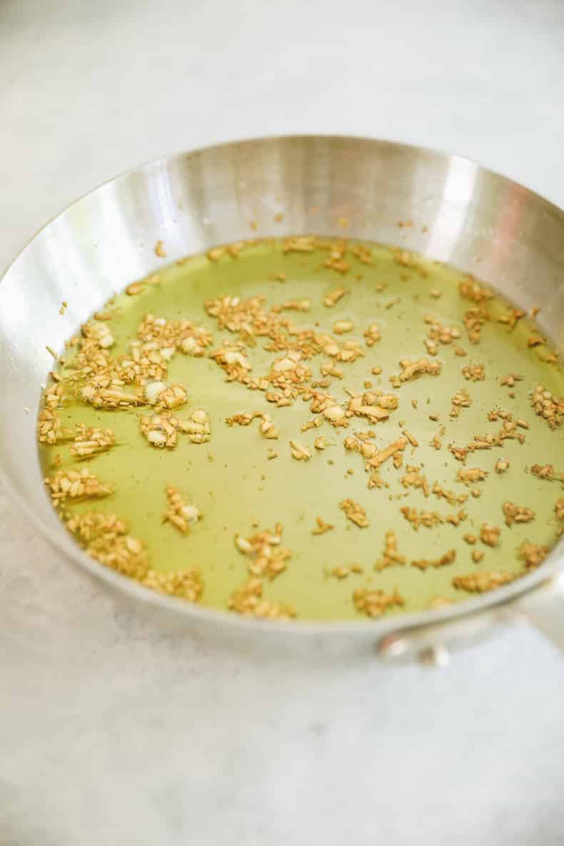 pan fried garlic in a small pan