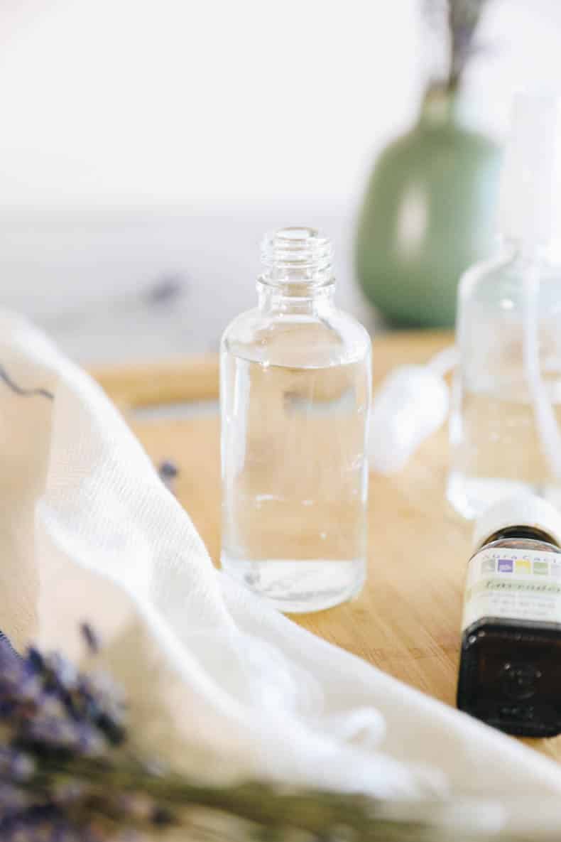 distilled water and witch hazel in a clear glass bottle