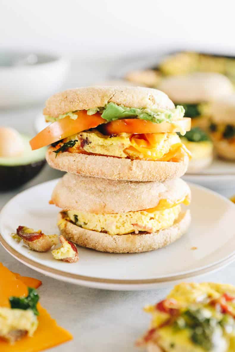 Meal prep breakfast sandwiches stacked on a plate.