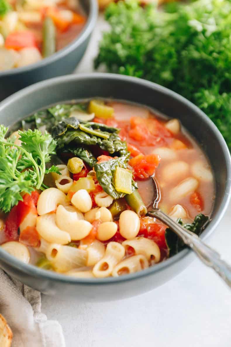 Minestrone recipe in a blue bowl.