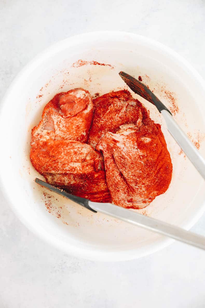 chicken thighs coated in a paprika rub.