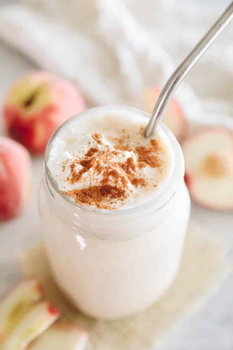 peach smoothie in a mason jar.