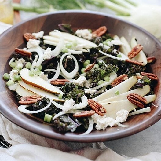 A crisp fall salad on a bed of massaged kale, this Pear Fennel and Ricotta Kale Salad will make dinner prep a breeze for those cooler and darker fall evenings.