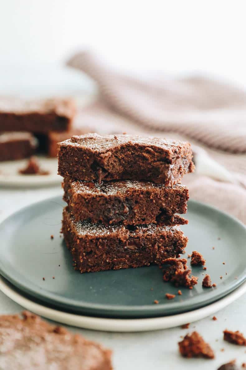 protein brownies stacked on a plate.