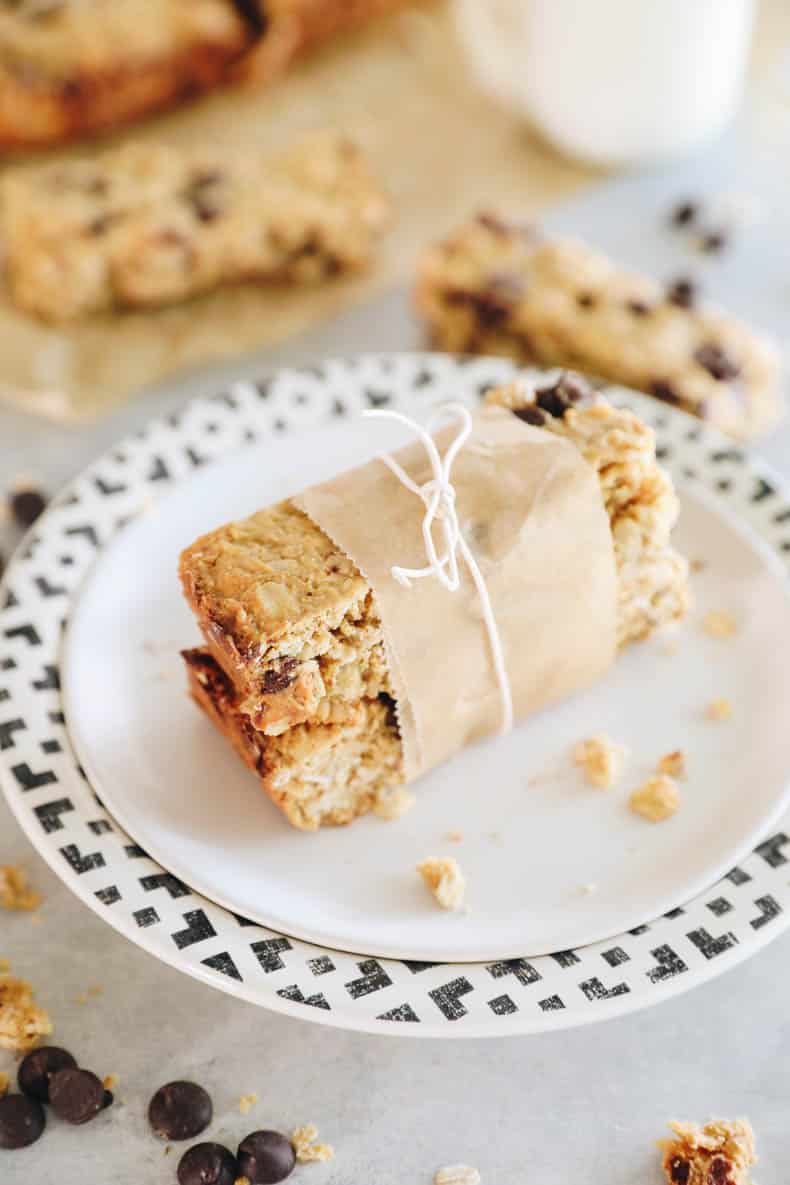 protein granola bars stacked and wrapped with parchment and a string bow.