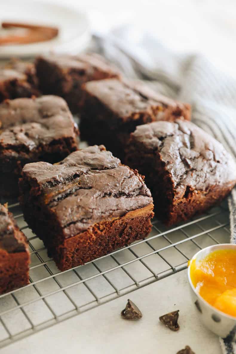 healthy baked pumpkin brownies on a wire rack.