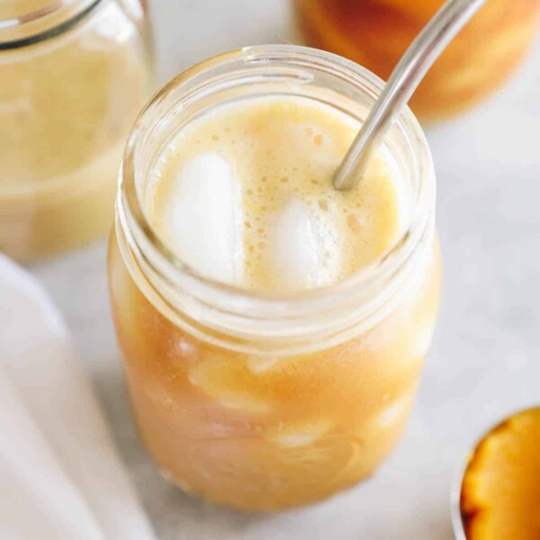 pumpkin cream cold brew in a mason jar over ice.