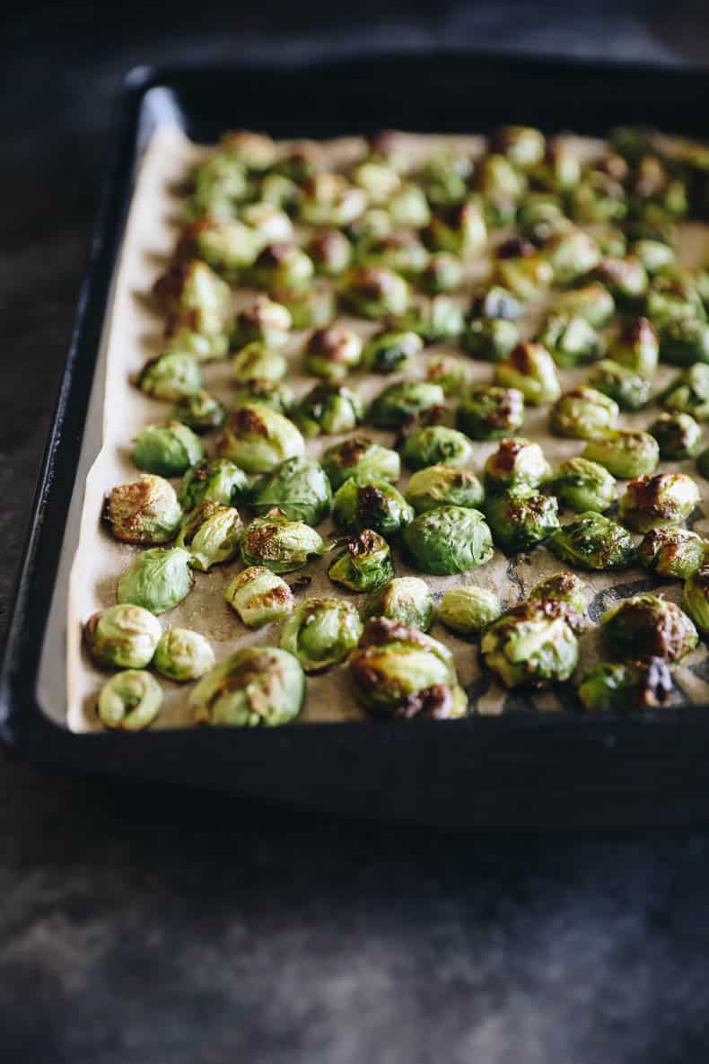 roasted brussel sprouts with balsamic on a sheet pan.