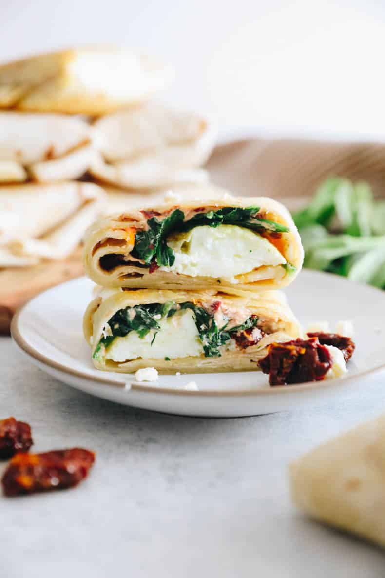 spinach feta wrap on a white plate