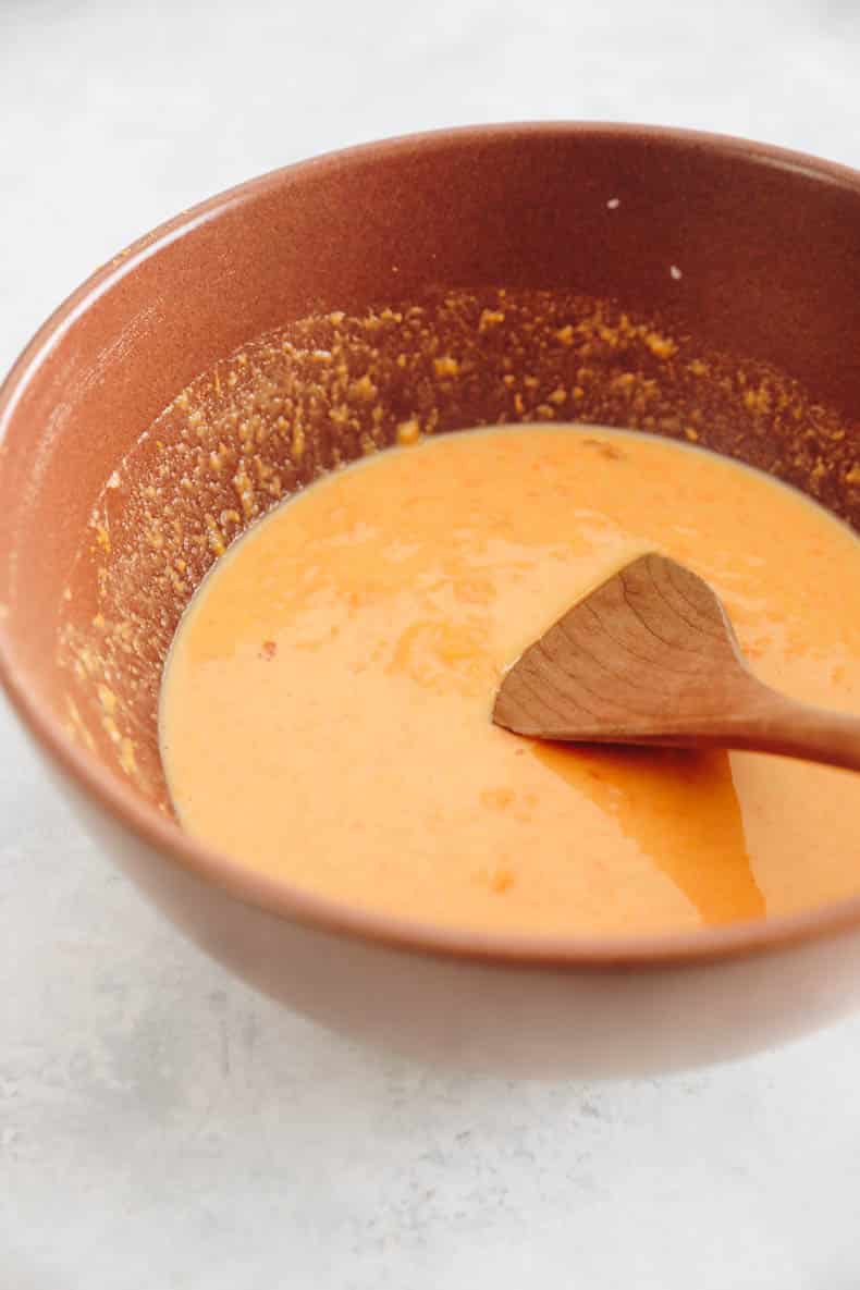 sweet potato, egg, almond milk and vanilla extract in a mixing bowl.