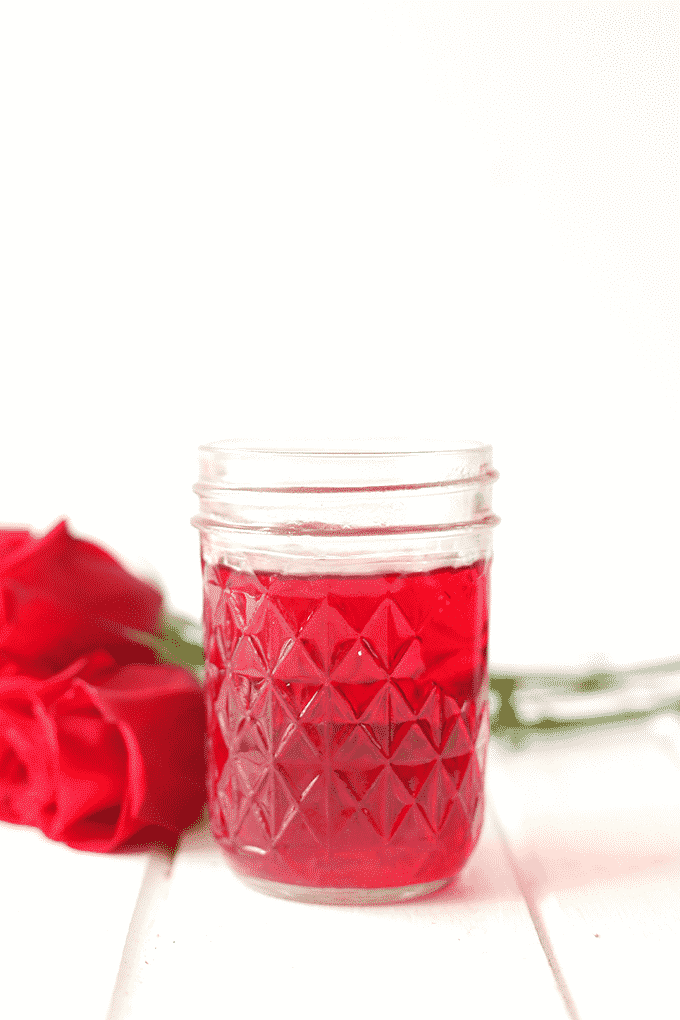 a mason jar with homemade rose water